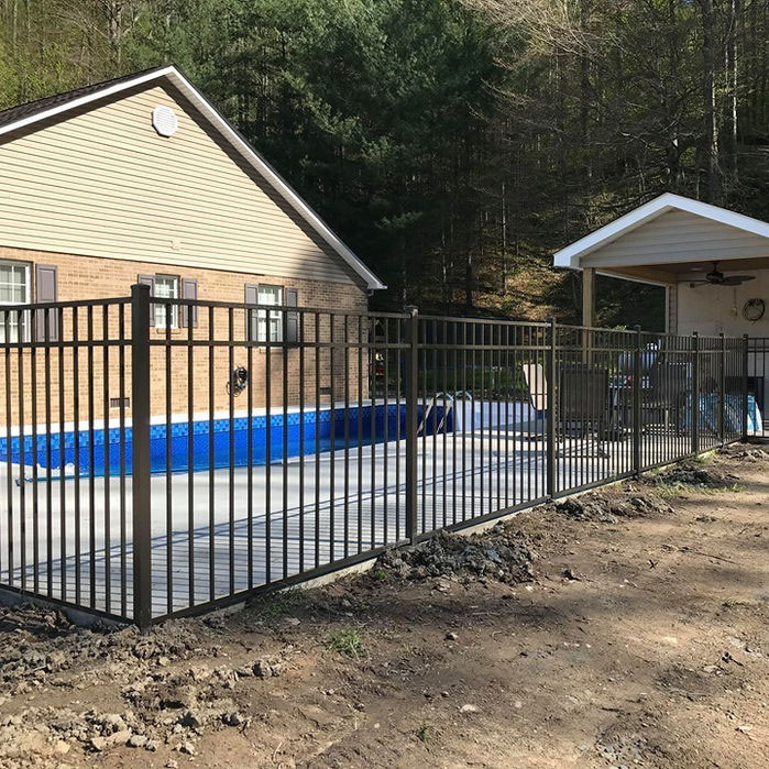 Ornamental aluminum fence around a backyard pool