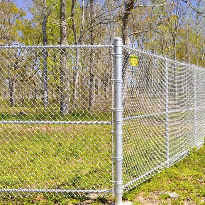 Galvanized chain-link fence along a property line